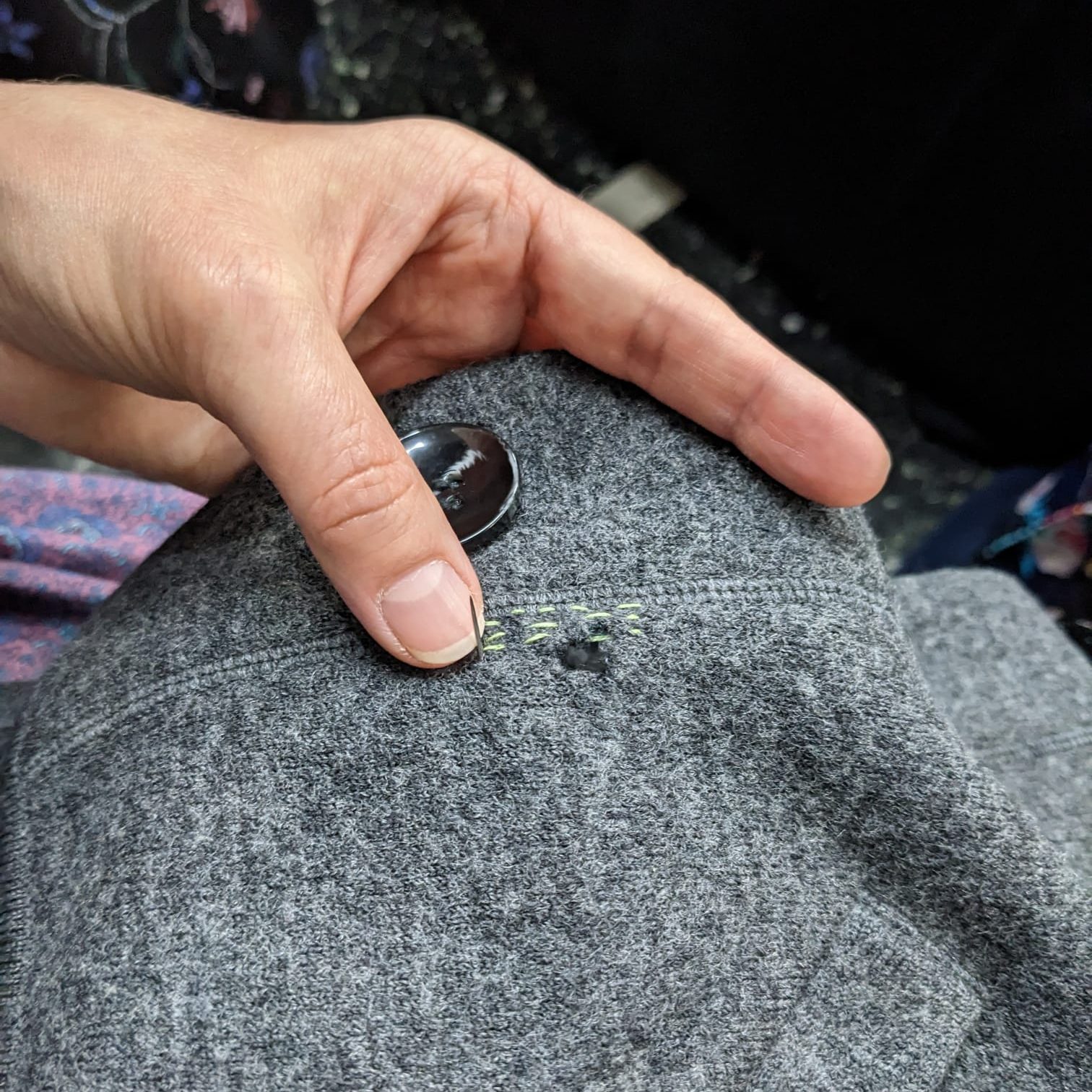 Mending a woolen cardigan hole